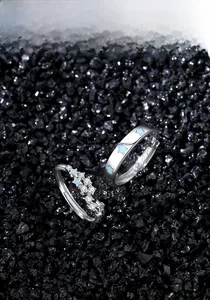 Detail of S925 silver couple rings with blue stars and zircon on black crystals