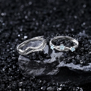 S925 sterling silver couple rings with floral and wave design on black stone base