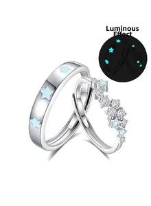 Detailed view of luminous S925 sterling silver couple rings with blue glowing stars