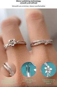 Dettagli macro di anelli in argento S925 regolabili con motivi di fiori e rami