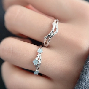 S925 sterling silver couple rings featuring minimalist wave and blue floral designs