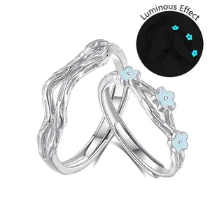S925 sterling silver couple ring set with luminous blue flower and tree bark texture