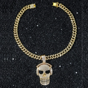 Detailed view of hip-hop skull pendant with headphones and iced out zircon stones