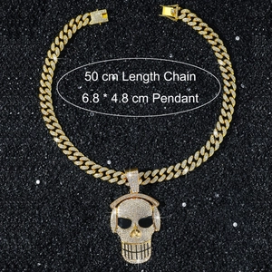 Close-up of hip hop skull pendant with headphones and 50cm gold Cuban chain details