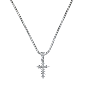 Detail shot of iced out silver tennis chain with hip hop thorn cross pendant jewelry