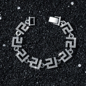 Men's 14mm silver Greca chain bracelet with iced out diamonds on black stone background