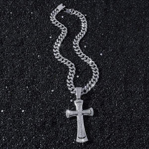 Iced-out silver cross pendant with thick cuban link chain for hip hop street style