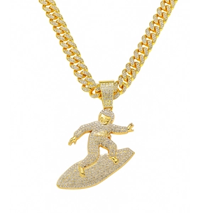Men's hip hop gold Cuban link chain necklace featuring a full diamond surfer boy pendant