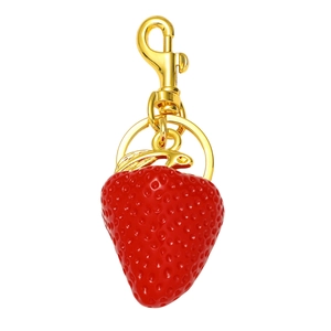 Polished red resin strawberry keychain with golden metal ring and clasp on white background