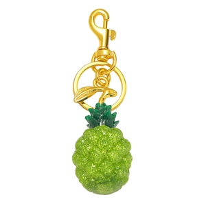 Sparkling green resin pineapple keychain with gold lobster clasp and small bird charm