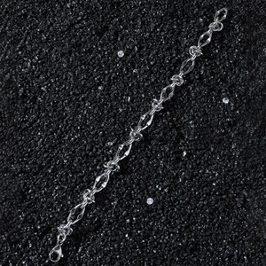 Polished silver stainless steel hip-hop link chain bracelet on dark stone background