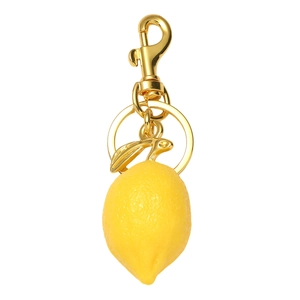 Close-up of realistic yellow resin lemon keychain with gold metal leaf and lobster clasp