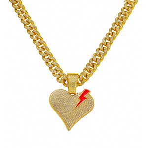 Iced out gold cuban link necklace with broken heart and red lightning bolt pendant