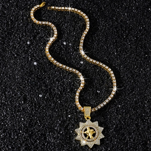 Hip hop gold tennis chain necklace with iced out rotating sunflower pendant on black background