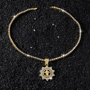 Close-up of gold iced-out tennis chain and spinning cross sunflower pendant for men