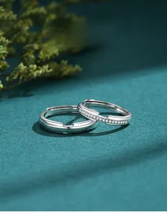 Close-up of S925 sterling silver couple rings with sparkling pavé cubic zirconia detail