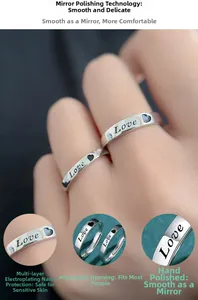 Macro shot of S925 sterling silver adjustable rings with Love engraving and heart motif