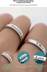 Close-up of S925 silver adjustable couple rings with Forever Love engraved lettering