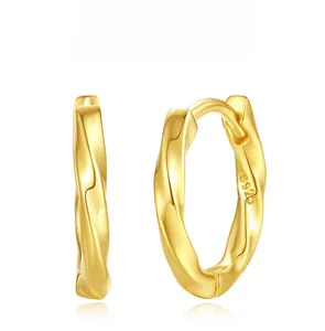 Detailed view of Mobius gold S925 sterling silver hoop earrings with irregular twist design