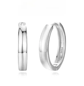 Macro view of polished S925 sterling silver hoop earrings with secure clasp and hallmark