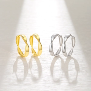 Minimalist twisted 925 sterling silver hoop earrings in gold and silver finish with dynamic shadows