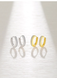 Detailed view of S925 silver and gold-plated hoop earrings with sparkling zircon stones