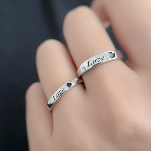 S925 sterling silver couple rings set with Love engraving and heart motif on hands