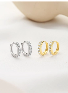 Detailed view of S925 silver hoop earrings with clear pavé zircon in gold and silver