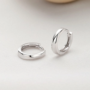 Minimalist S925 sterling silver huggie earrings with polished pleated finish