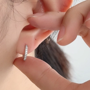 Elegant S925 sterling silver hoop earrings with shimmering pave crystals on model