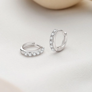 Minimalist S925 sterling silver hoop earrings featuring sparkling half-row claw-set zircons