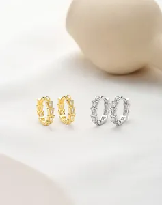 Close-up of S925 sterling silver hoop earrings with trapezoidal micro-pave crystals