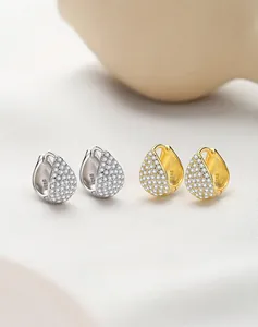 Detail of S925 hallmark on teardrop earrings with pave-set cubic zirconia stones