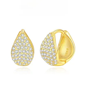 Close-up of S925 silver gold-plated teardrop earrings with pave-set cubic zirconia