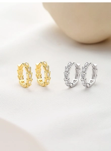 Detailed close-up of S925 silver earrings with trapezoid micro-pave cubic zirconia