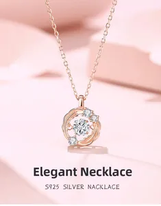 Detail of s925 silver dancing necklace with rose gold finish and a beating heart stone