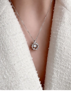Macro view of sterling silver necklace with sparkling heart-shaped zirconia pendant