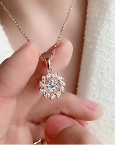 Detailed view of s925 silver windmill pendant necklace with sparkling moissanite stones
