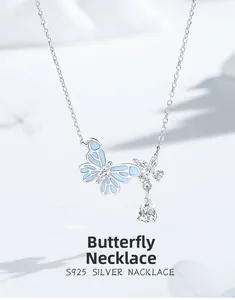Detail of S925 silver necklace with blue butterfly pendant and teardrop zircon