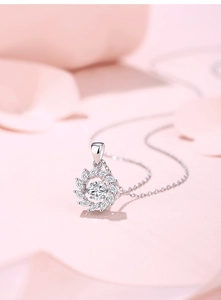 Macro shot of S925 silver necklace with sparkling wreath pendant and moissanite stones