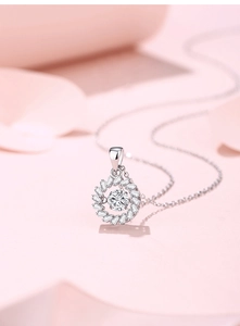 Detailed macro view of S925 silver necklace with moissanite pendant and flower halo