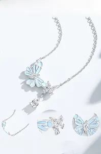 Detailed view of s925 silver butterfly necklace with cubic zirconia and blue enamel