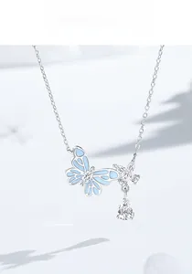 Macro shot of S925 sterling silver butterfly pendant with blue enamel and pear-cut zircon