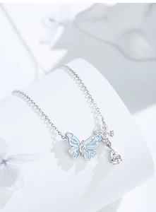 Macro shot of S925 silver butterfly necklace with blue enamel and zircon stones