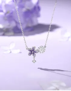 Close-up of S925 silver cherry blossom necklace with purple enamel and zircon details