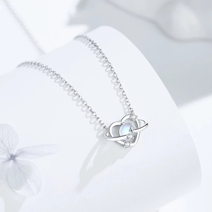 S925 silver heart planet necklace featuring a moonstone pendant on a white background