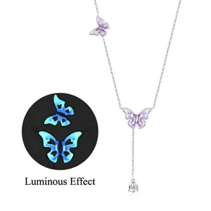 925 silver butterfly necklace with purple enamel, showing blue glow in the dark effect