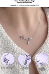 Detail of 925 silver necklace with purple enamel butterflies and cubic zirconia drop