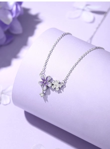 Detailed close-up of S925 silver flower necklace with purple enamel and sparkling zircon