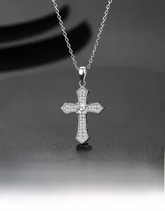 Macro shot of S925 silver cross pendant with shimmering pavé zircon stones and center diamond